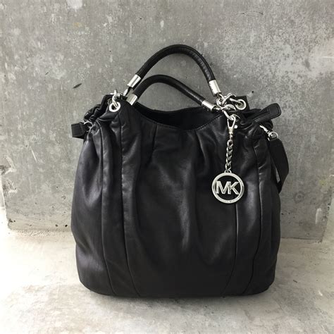 are michael kors purses leather or pvc leather|Michael Kors genuine leather handbags.